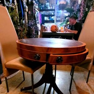Antique round table on wheels